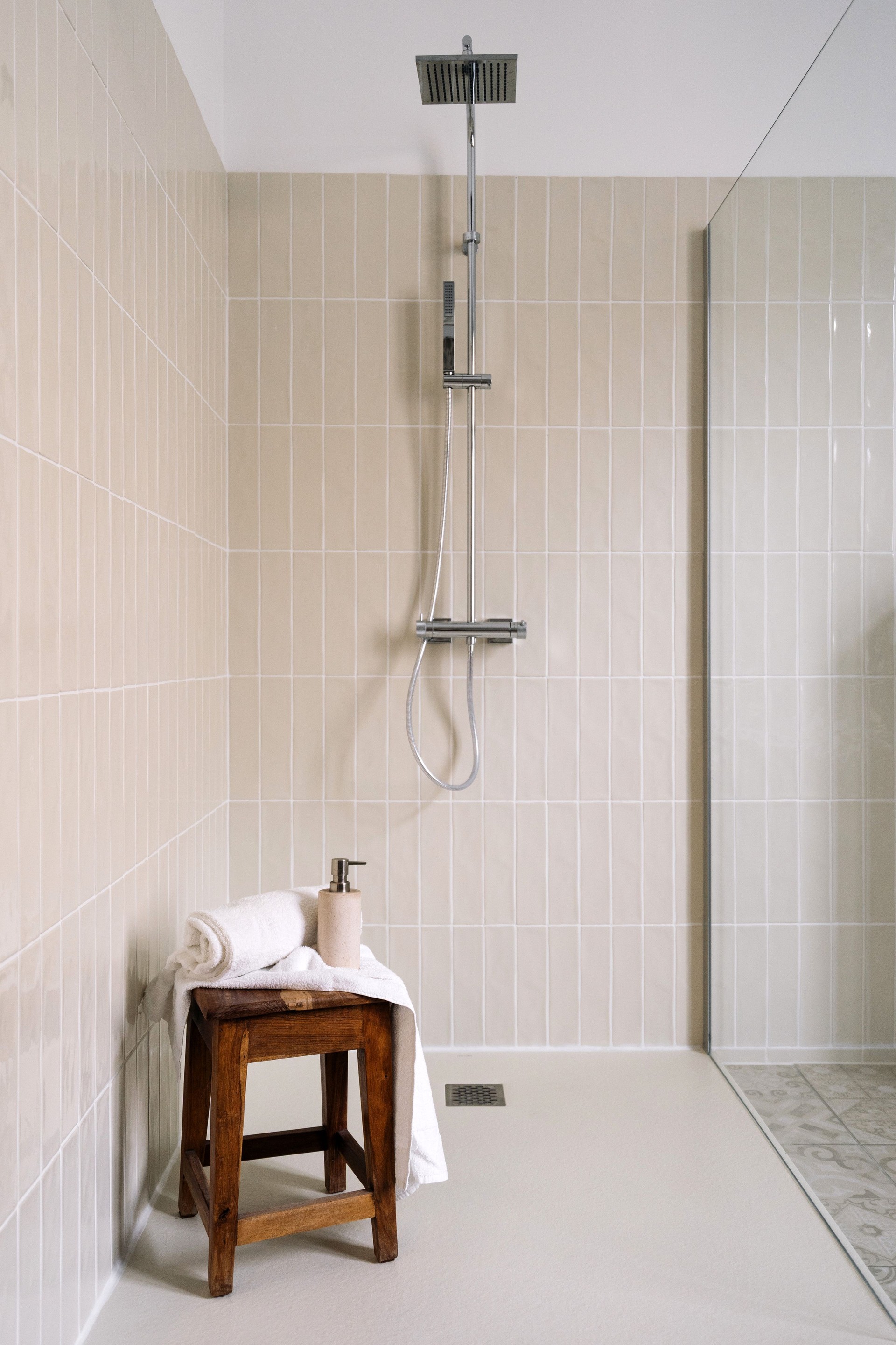 Modern bathroom featuring a sleek shower cabin and elegant design elements
